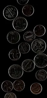 Scattered coins against a dark background wallpaper.