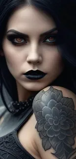 Gothic portrait with dark makeup and tattooed shoulder.