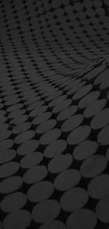 Dark geometric pattern with circles creating an abstract design in dark gray.