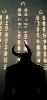 Silhouette of horned figure before gothic illuminated windows.