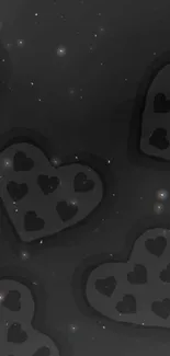 Black hearts on dark background wallpaper.