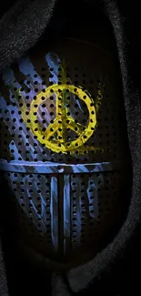 Dark helmet with peace symbol in vibrant yellow and blue art design.