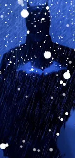 Silhouette of dark hero in a snowy, blue night setting.