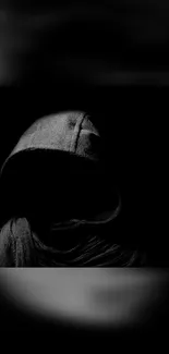 Dark hooded figure in shadows wallpaper.