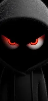 Dark hooded figure with glowing red eyes wallpaper.