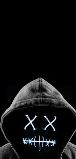 Dark hooded mask with glowing face on black background.