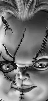 Black and white image of a stitched horror doll with a chilling expression.