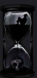 Dark hourglass with skull and silhouette art wallpaper.