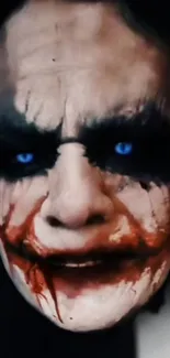 Intense and dark clown face with blue eyes on a phone wallpaper.