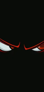 Dark wallpaper with intense red eyes on a black background.