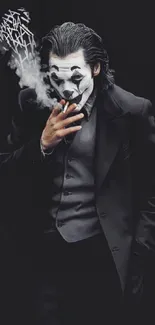 Mysterious Joker figure exhaling smoke in a dark themed wallpaper.