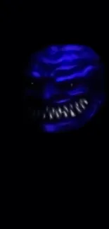 Eerie dark wallpaper with monstrous blue face.