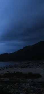 Dark mountain landscape with night sky.