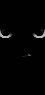 Dark wallpaper with mysterious, glowing eyes on a black background.