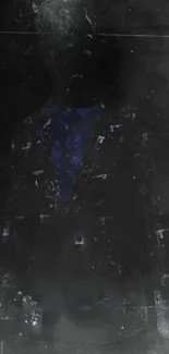 Mysterious figure in a dark suit with blue accents.