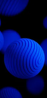 Vibrant neon blue spheres on dark backdrop.