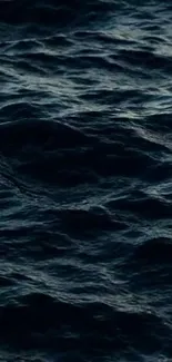 Dark ocean waves creating a tranquil mobile wallpaper.