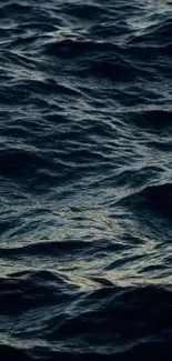 Dark ocean waves form calming mobile wallpaper background.