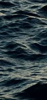 Dark ocean waves creating a tranquil mobile wallpaper.