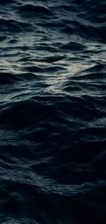 Dark ocean waves creating a serene and mysterious mobile wallpaper.