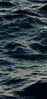 Dark ocean waves forming a serene and textured pattern.