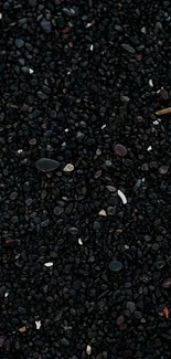 Mobile wallpaper featuring dark pebbles creating a minimalistic texture.