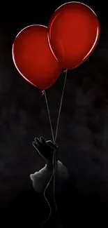 Mysterious dark wallpaper with two red balloons.