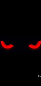Dark wallpaper with glowing red eyes.