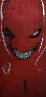 Intense dark red wallpaper with grinning face design.