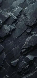 Dark textured rock wallpaper with intricate patterns.