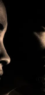 Silhouette of two faces in dramatic shadow for mobile wallpaper.