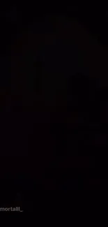 Dark silhouette with mysterious shadowy figure on a mobile wallpaper.
