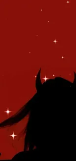 Silhouette of a figure with devil horns on a deep red background.