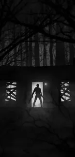 Dark figure in forest with eerie cabin, black and white mobile wallpaper.