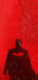 A dark silhouette with bat ears on a red textured background.