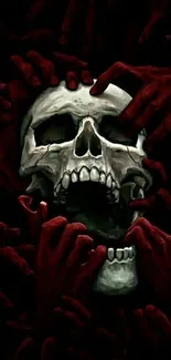 Dark skull surrounded by red hands in eerie wallpaper.