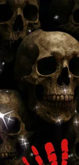Dark skull mobile wallpaper with red handprint.