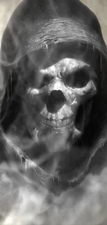 Eerie hooded skull with smoke effect on dark background.