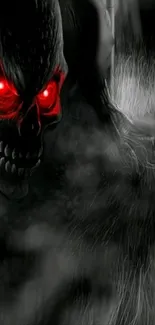 Dark skull with glowing red eyes and misty background wallpaper.