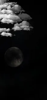 Dark night sky with clouds and subtle moon.