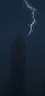 Lightning striking above a city skyscraper at night.