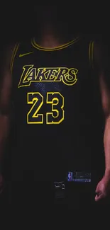 Dark basketball jersey with yellow highlights on a black background.