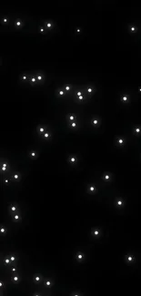 Black wallpaper with glowing white stars resembling a night sky.