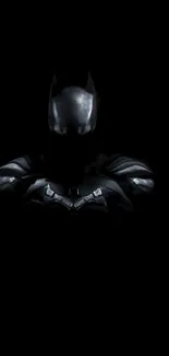 Dark superhero silhouette on black background wallpaper.