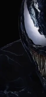 Dark symbiote with sharp teeth on black background.