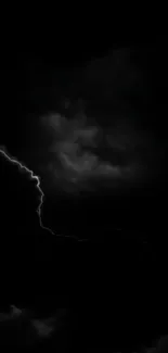 A dark thunderstorm night with lightning in black clouds.