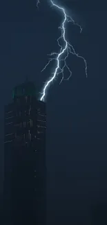 Lightning striking a dark tower at night in an urban setting.