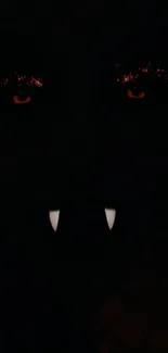 Dark-themed wallpaper with vampire eyes and fangs.