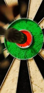 Focused dart hitting the center of a black and beige dartboard.