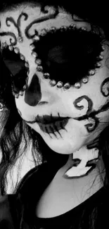 Black and white Day of the Dead inspired face paint design.